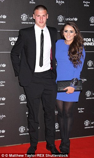 Sam Johnstone (pictured with his partner Bryony Turner) became the latest Manchester United player to be targeted by thieves when his home in Sale, Manchester, was robbed six weeks ago