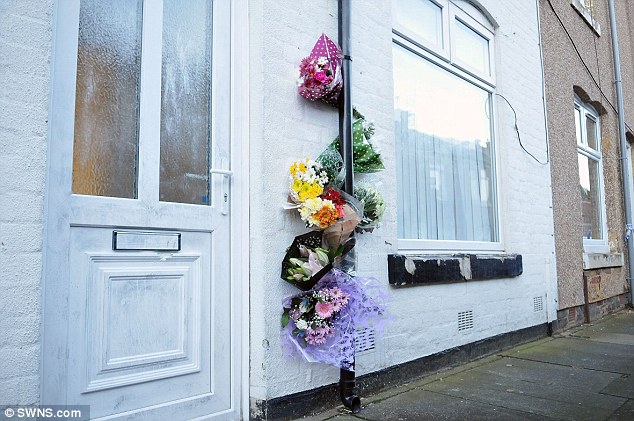 Flowers were left outside of Miss Wrightson's house following the murder on December 8, 2014