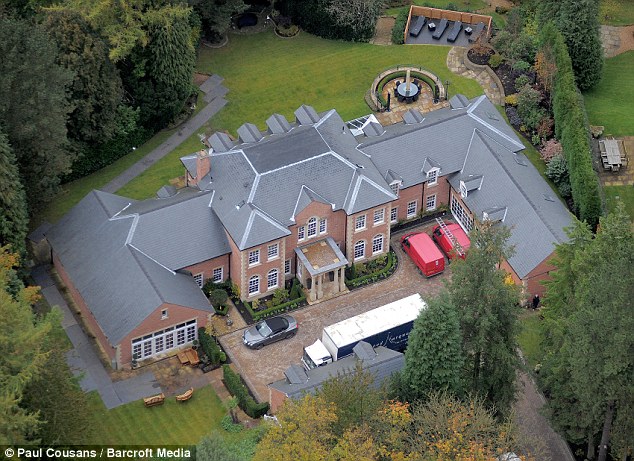 Wayne Rooney , 30, was playing his testimonial match at Old Trafford on Wednesday when a masked intruder tried to break into his £6million mansion in a Cheshire village (pictured)