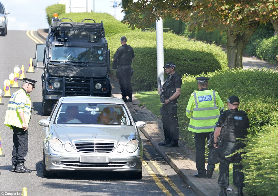 Police presence: A motorist in a Mercedes-Benz is pulled over by officers as part of random routine checks at the airport. There is no suggestion that there was any specific reason for stopping the drivers