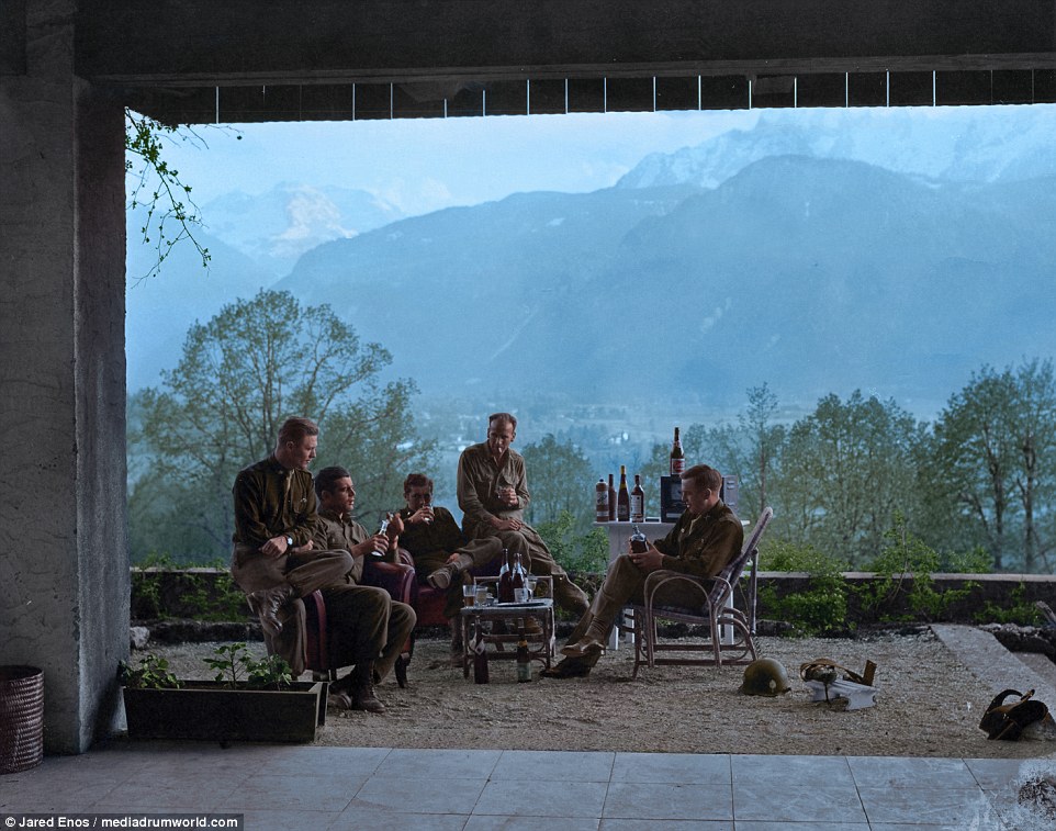 Members of the USA's Easy company celebrate VE Day (May 8, 1945) in Adolf Hitler's Berchtesgaden residence in Austria. After a short bombing campaign of the town of Obersalzberg, where the house was located,  troops seized the residence.  Easy company want onto inspire the multi-award winning series Band of Brothers. Left to right: Major Richard Winters, Captain Lewis Nixon, First Lieutenant Harry Welsh, First Lieutenant Thomas Peacock. Enos could not identity the soldier on the far right. 