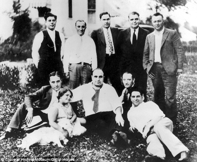 Family: Capone's family (pictured, with the mob boss center-bottom, in 1929) helped him through his final days, and he would hunt for butterflies with his granddaughter