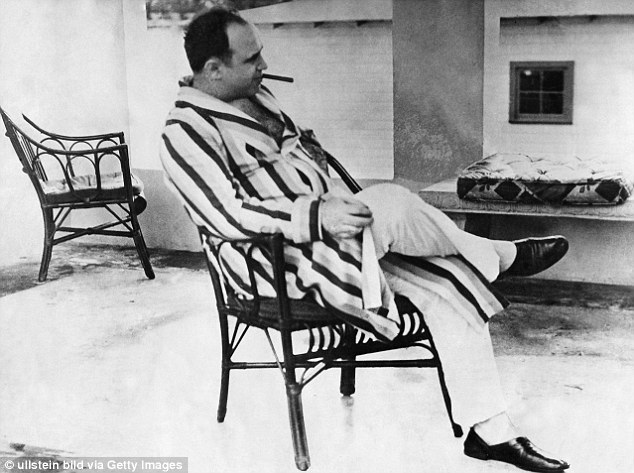 The end: Capone (pictured in 1931) spent his final days walking in his pajamas with the mental age of a 12-year-old. He died in 1947 after a stroke, heart attack and pneumonia