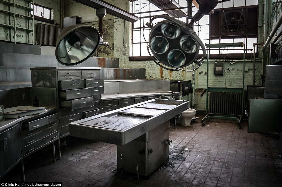 This creepy image shows a blood-stained operating table in the theater where patients would have been taken for surgery