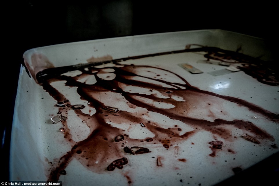 When the hospital closed little care seems to have been taken to clear it out with blood-stained tables left behind