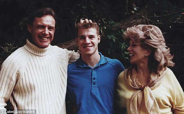 Hamilton-Byrne (right) and her husband Bill (left) pose with teenager who was brought up in the sect