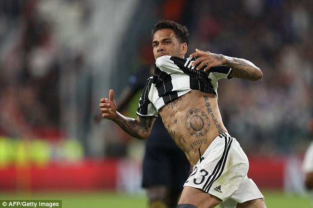 Dani Alves celebrates after scoring a spectacular goal against Monaco on Tuesday night