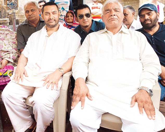 Geeta's father Mahavir Singh Phogat (right) on the set for Dangal. Wrestling brought Geeta honour and recognition, while the film about how her obsessed father Mahavir Singh Phogat moulded her into a champion wrestler made her a celebrity.