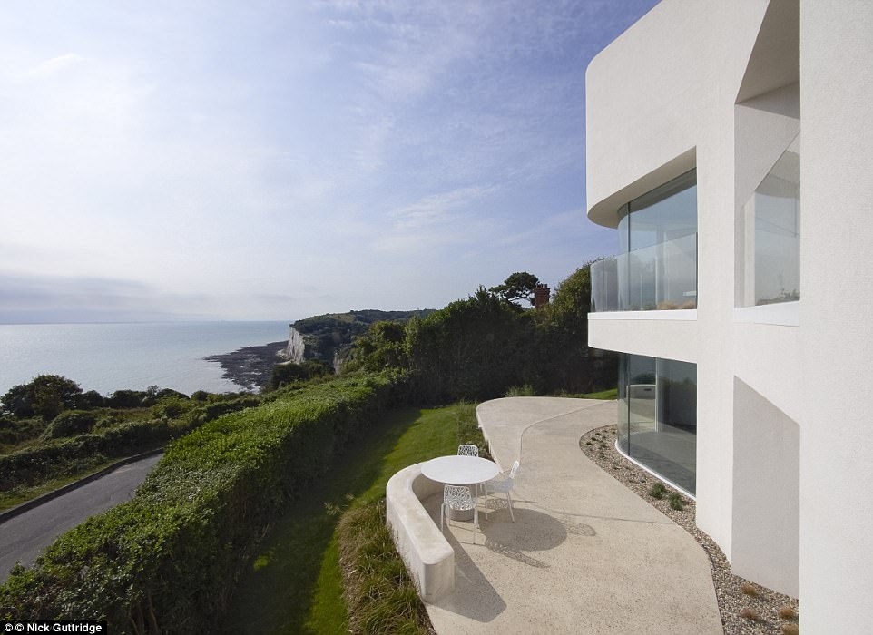 Mirroring the landscape: The smooth, white undulating exterior is inspired by the White Cliffs on which the property sits