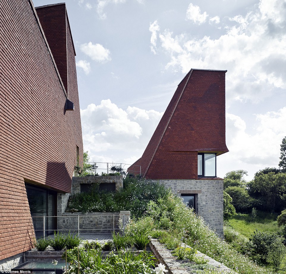 At one with nature: The extensive landscaping surrounding the house, pictured, is still in its infancy, yet there is already evidence as to how this will help to seamlessly connect the house to its setting, a year or two from now, the judges noted