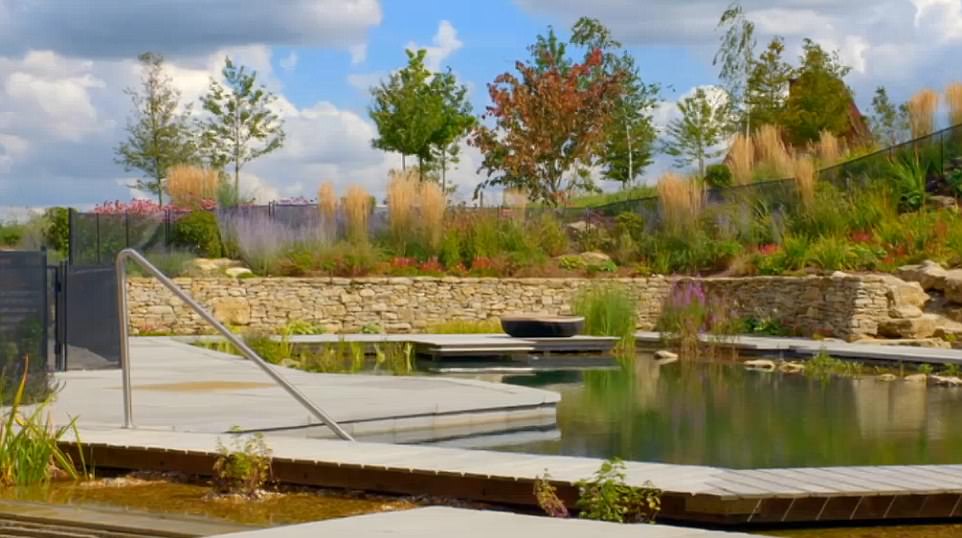 Landscape: Caring Wood's garden is something to behold, with a large pond surrounded by beautiful plants and trees that captures the essence of nature