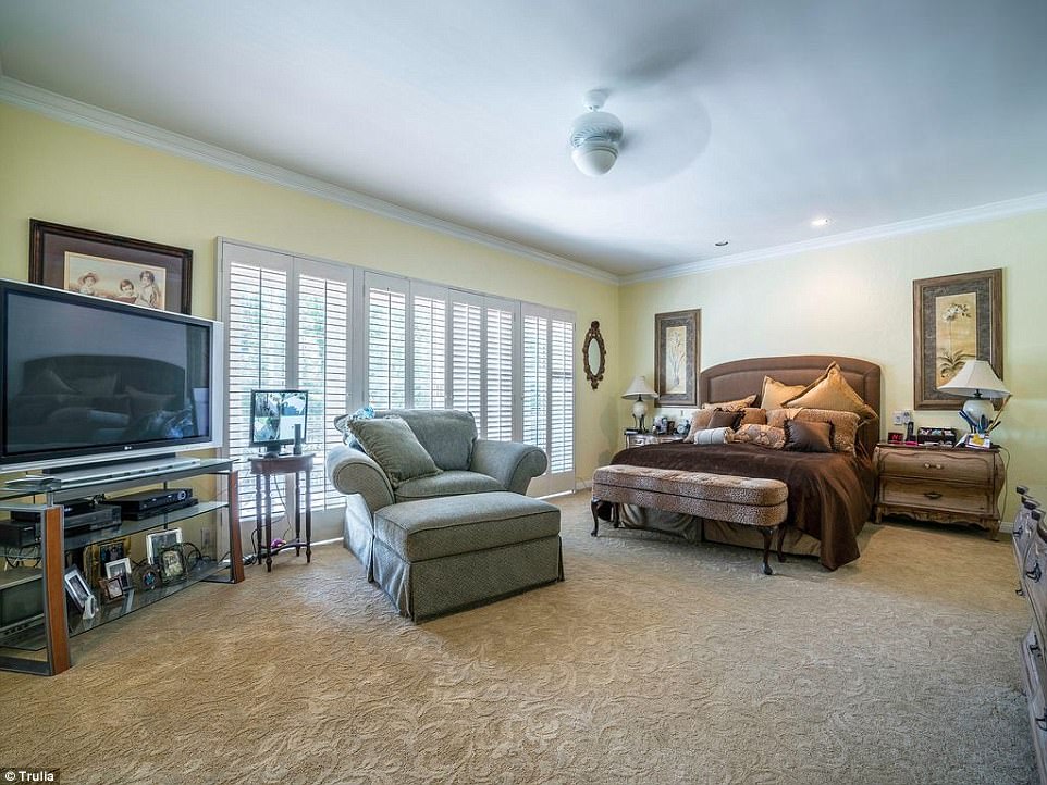 Sweet dreams: A large, carpeted bedroom was complete with large windows 