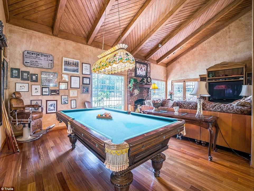 Good times: A game room featured hard wood floors and it's own fire place