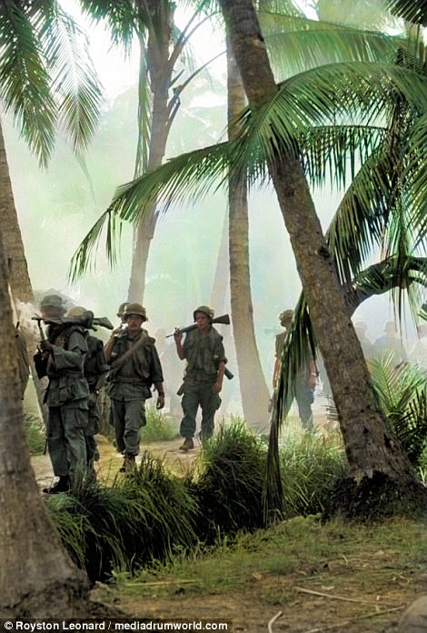 Soldiers making their way through Vietnam's dense woodland