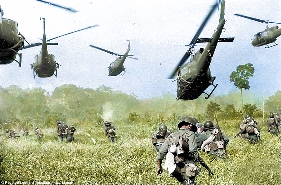 Hovering US Army helicopters pour machine-gun fire into the tree line to cover the advance of South Vietnamese ground troops as they attack a North Vietnamese army camp eighteen miles north of Tay Ninh, near the Cambodian border, March 1965