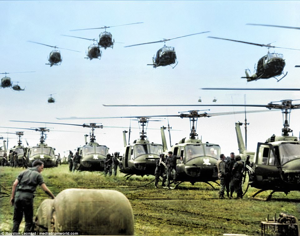 US Army helicopters providing support for US ground troops fly into a staging area fifty miles northeast of Saigon, Vietnam, August 28, 1966. Helicopter fuel is stored in the large rubber tanks, foreground