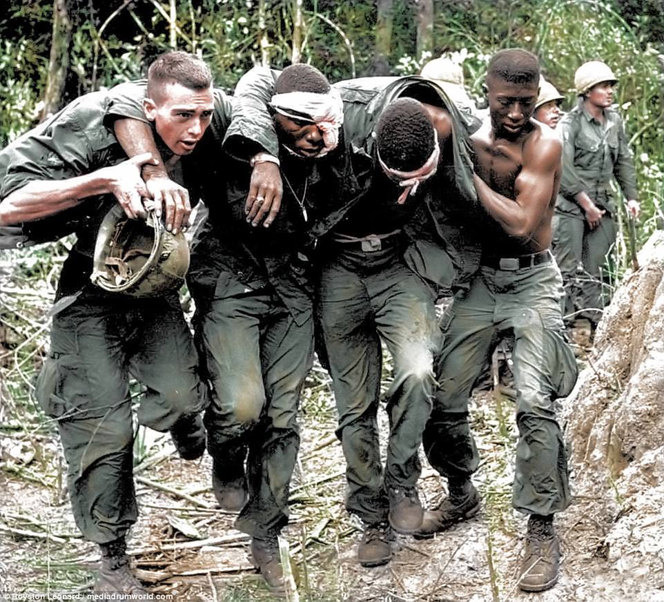 Wounded US paratroopers are helped by fellow soldiers to a medical evacuation helicopter on October 5, 1965, during the Vietnam War. Paratroopers of the 173rd Airborne Brigade's First Battalion suffered many casualties in the clash with Viet Cong guerrillas in the jungle of South Vietnam's D Zone, 25 miles Northeast of Saigon