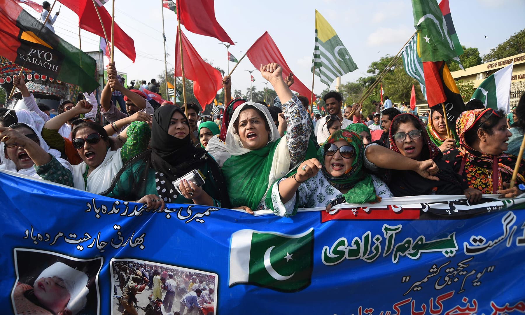 Women shout anti-Indian slogans as they take part in Independence Day celebrations in Karachi. — AFP