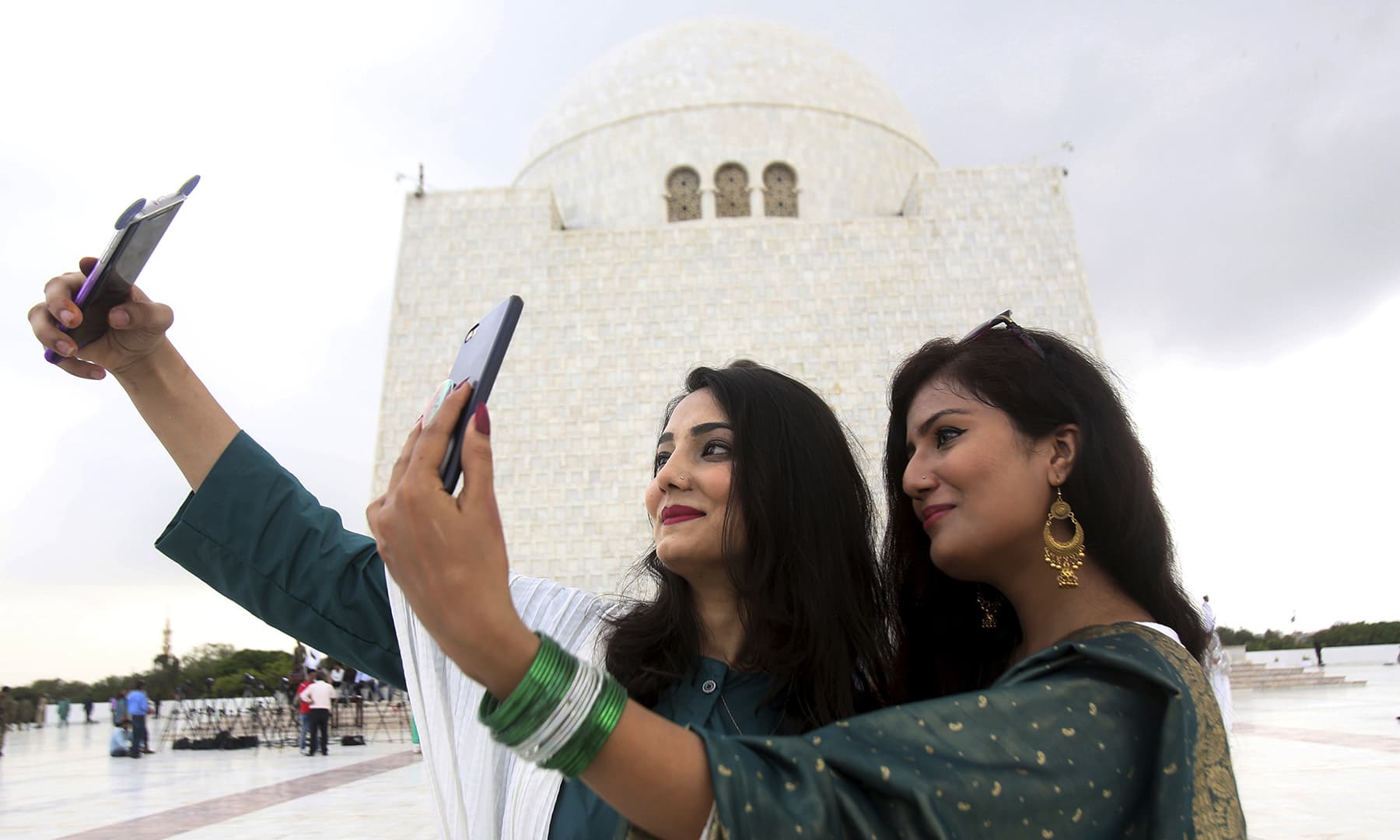 Women take a selfie during their visit to the mausoleum of Quaid-i-Azam Muhammad Ali Jinnah. — AP