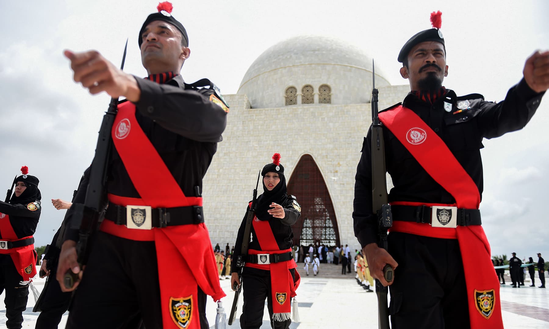 Police with the Special Security Unit (SSU) personnel march in front of the Quaid's mausoleum in Karachi. — AFP