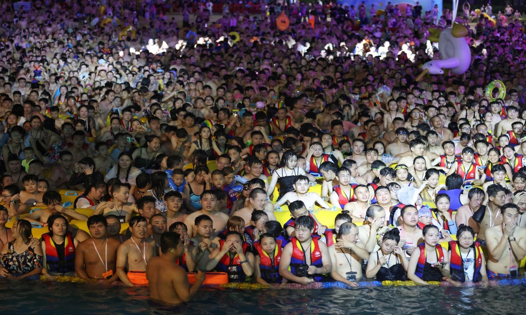 People enjoy a music party inside a swimming pool at the Wuhan Maya Beach Park on August 15, 2020. — Reuters