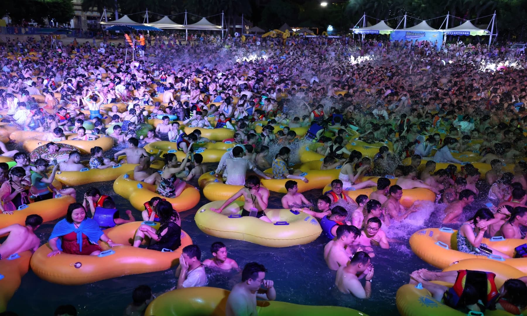 People enjoy a music party inside a swimming pool at the Wuhan Maya Beach Park on August 15, 2020. — Reuters