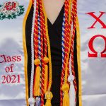 greek org honor stole and mutliple graduate cords on graduate