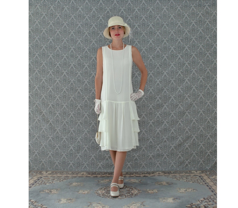 Great Gatsby Dress – Great Gatsby Dresses for Sale     A darling 1920s-inspired dress in cream with tiered skirt Roaring 20s fashion Great Gatsby dress 1920s flapper dress Downton Abbey dress  AT vintagedancer.com