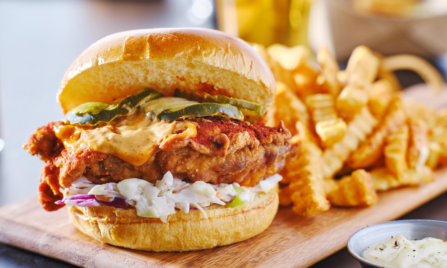 spicy nashville hot chicken sandwich with coleslaw and pickles