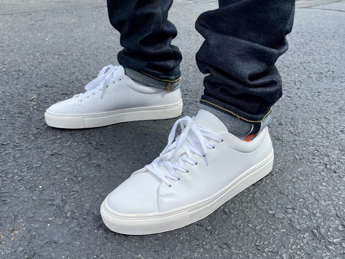 A close-up of someone's feet in the Wolf & Shepherd Glider Sneakers.