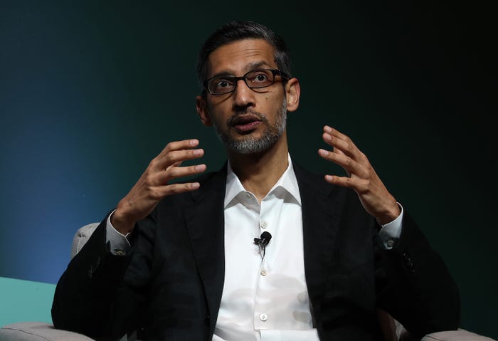 Google CEO Sundar Pichai gestures while giving a speech.