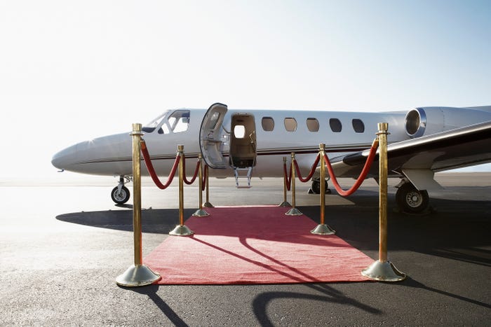 private plane with red carpet