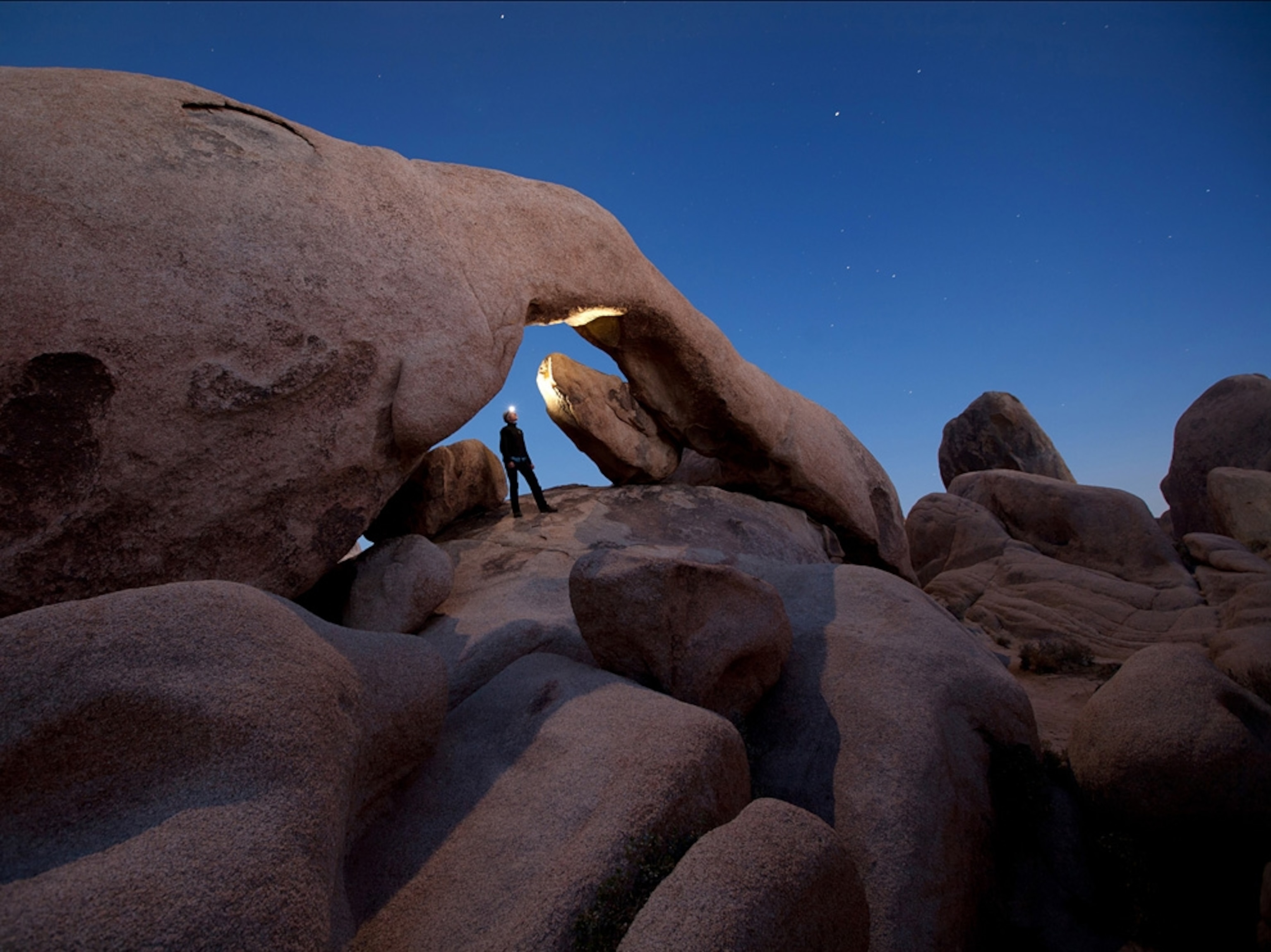 A hiker posing for a self-portrait in Joshua Tree National Park