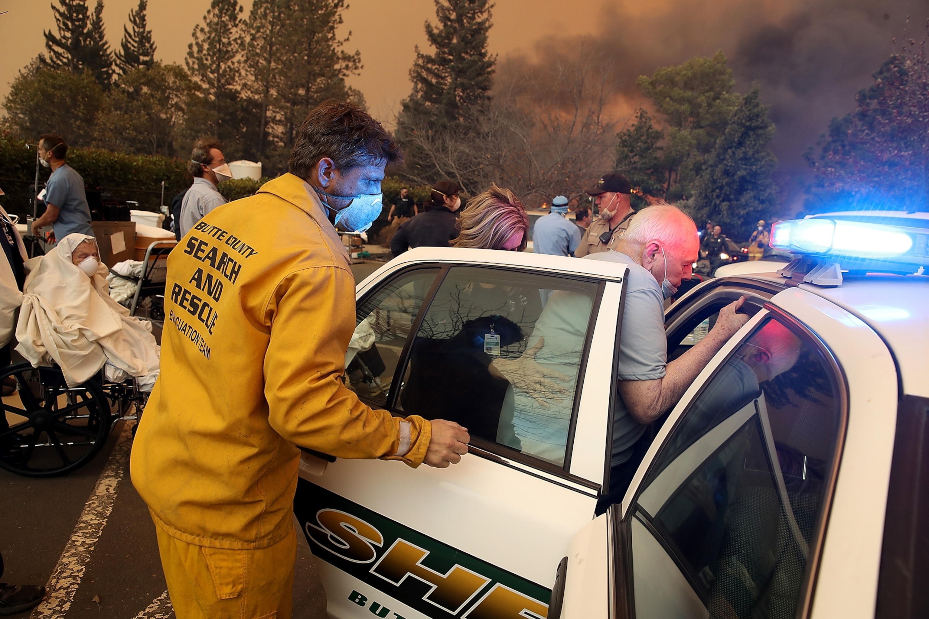 hospital workers and first responders evacuating patients