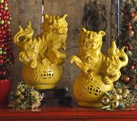 Yellow Foo Dog statues, most commonly found usually at the entrance to a doorway, but now setting the aura for protecting your Christmas this holiday.