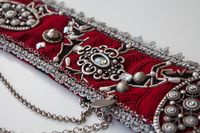 "ONE OF A KIND. \"Red Fighter\", my new Tribal Fusion inspired beauty. Sumptuous brocade fabric in a fabulous shade of red and black motifs all embroidered with silver beads. Metallic decorations fill out with rhines. Using rhinestones, beads, chains,pearls Cuchi buttons, coins, silver braids, tribal amulets. This belt is 31.9 inches/81 cm long from O ring to O ring. It will fit on 35'- 36.6' inches (89- 93 cm) low hips peripheral which is (3-4 cm) or (1.18-1.57 ') below belly button. Fits with