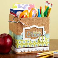 Teacher Survival Kit  Transform a box or basket into a school-year survival kit by decorating it with scrapbooking supplies. Self-adhesive cork paper, patterned paper, and embellishments emphasize the school theme. Fill the kit with essentials for a teacher.