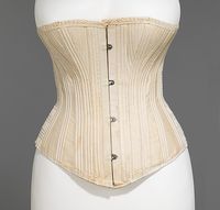 1885 Corset  Culture: American  Medium: cotton, metal, elastic, boneThis particular type of corset was flexible, made possible by the shirred elastic sections over the interior coiled wire spring system. It was designed for women to wear while participating in athletic activities such as horseback riding, while still maintaining the acceptable silhouette of the period.