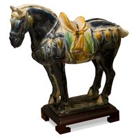 One of the great artistic achievements in the Tang Dynasty (618-906) was the invention of Tri-Color pottery. The technique has passed down to our present day as it manifests in this magnificent horse. Made by artisans from Luoyang, the ancient capital of nine dynasties throughout Chinese history.