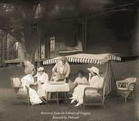 Genthe, A., photographer. Group of Women Seated Outdoors Having Tea. , None. Between 1906 and 1942. [Photograph] Retrieved from the Library of Congress, https://www.loc.gov/item/2018707745/.