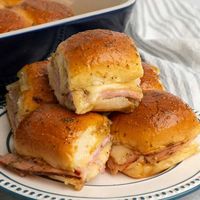 With layers of savory ham and melty cheese nestled inside of a toasted, buttery Hawaiian roll, these sliders are the perfect choice for a party appetizer or satisfying main meal.