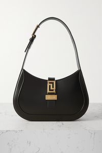 Shoulder bags are such a fun way to show the world your style, and this season, Versace goes for gold. It's been crafted in Italy from sleek black leather and sits snug under your arm. It's sized to fit just the essentials - slot your keys, cardholder and compact mirror into its cozy quarters.