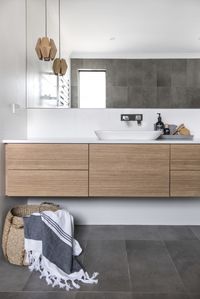 It's all in the details for Red Lily Renovations. They created this floating vanity to keep the bathroom simple and modern