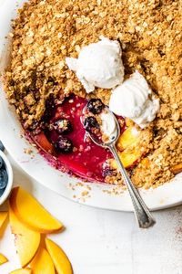 This Blueberry Peach Crisp is a wonderful summer dessert loaded with fruit, and delicious served warm out of the oven. #blueberrycrisp #peachcrisp #fruitcrisp #healthydessert