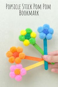 This easy popsicle stick pom pom bookmark is a great (and cheap!) way to give your kids a fun craft to make this summer!