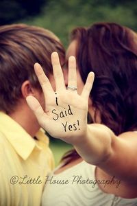 “Speak to the hand” photo idea that lets you show off your engagement ring while simultaneously announcing that you said yes! Double score!