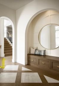 Arched entry way wall, accent floor design, beige neutral aesthetic