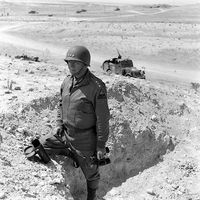 Gen. George S. Patton Jr commanding 2nd US Army Corps in North Africa makes a stopover to observe enemy positions