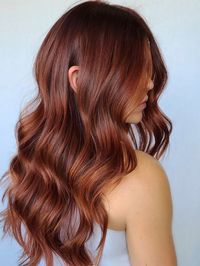 We're adding this dreamy redhead inspo onto the Pinterest board, stat. Rich and vibrant, this color is all about honing in on the darkest of ruby reds. #haircolors #haircolortrends #2021hairtrends #redhaircolor #southernliving