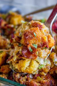 Cornbread Stuffing with Bacon and Sage from The Food Charlatan. Stuffing is never boring when there is bacon involved! This Cornbread Stuffing recipe has tons of bacon as well as sage and thyme to get those classic Thanksgiving aromas going on. The perfect side dish to go with turkey and gravy! #thanksgiving #stuffing #cornbread #bacon #celery #casserole #sidedish #easy #recipe #homemade #best #traditional #sage #thyme